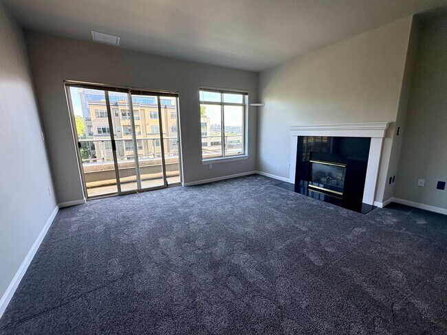 Building Photo - Top-Floor Corner 2BR with Lake Union Views + Garage Parking Included!