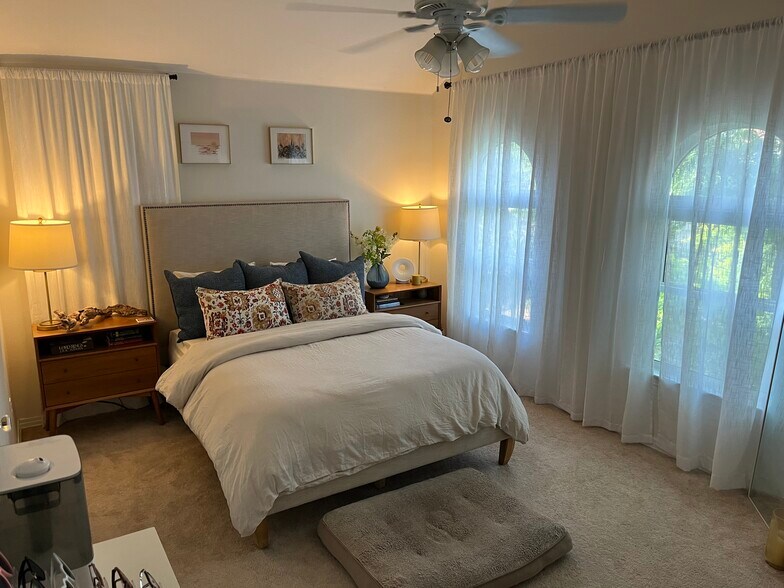 Master bedroom with master bath to the left. Additional ceiling height really opens up the room. - 1641 N Washington St