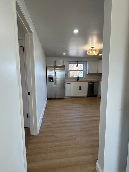 Hallway looking into bedroom and kitchen - 249 Dunlop Ave