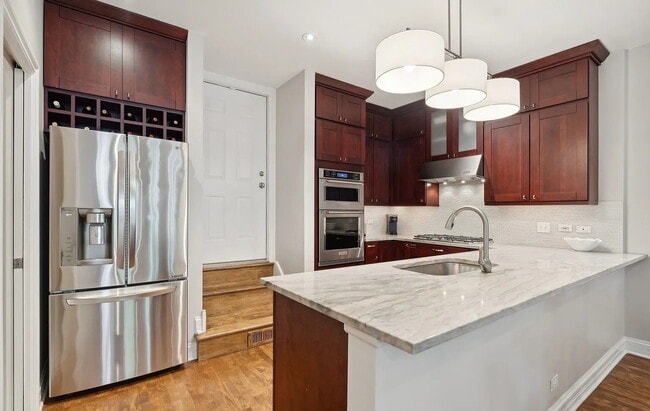 Building Photo - Upscale Living at Its Finest