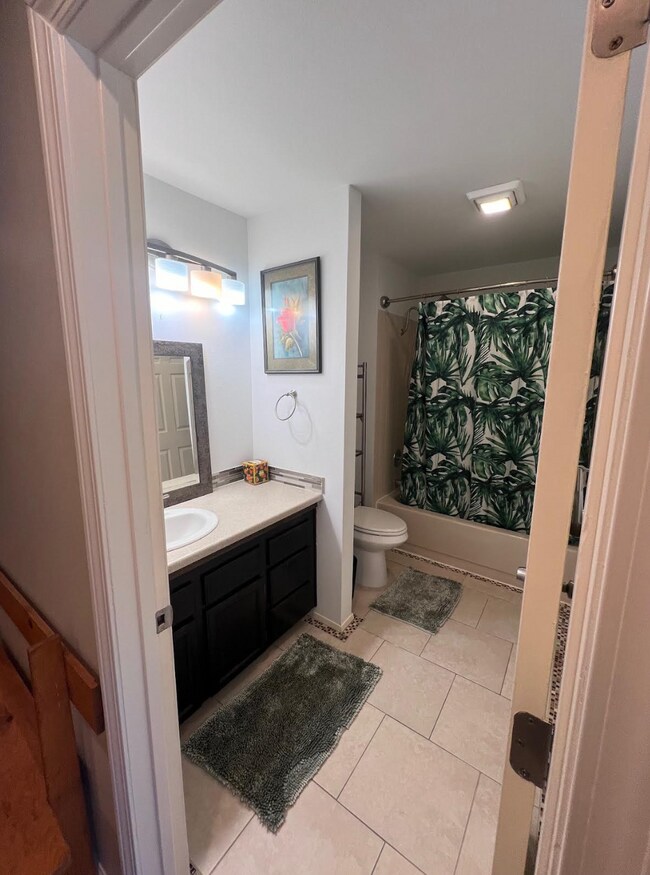 Full bathroom includes tub and shower and vanity - 1881 E Tudor Rd