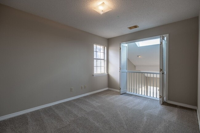 Building Photo - ONE FREE MONTH ON 13 MONTH LEASE! Welcome to this charming 3-bedroom, 2-bath condo located in the...