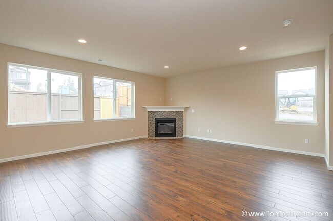 Building Photo - Spacious 4-Bedroom + Office Home in Abbey Creek – Modern Finishes, EV Charger & Low-Maintenance B...