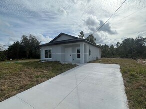 Building Photo - Brand new 2/1 -LARGE BACK YARD- LEHIGH ACRES