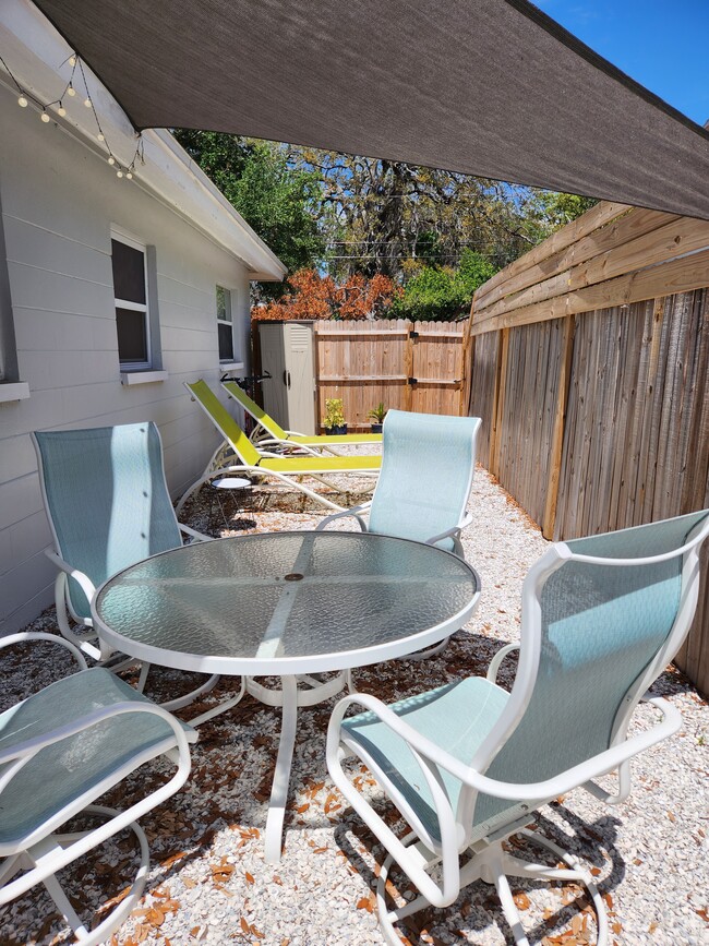 Fenced shared backyard lounge and dining area - 270 4th St NW