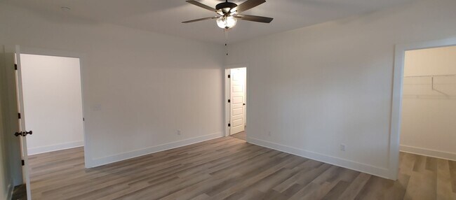 Building Photo - 5-bedroom home with 3 car garage and fully...
