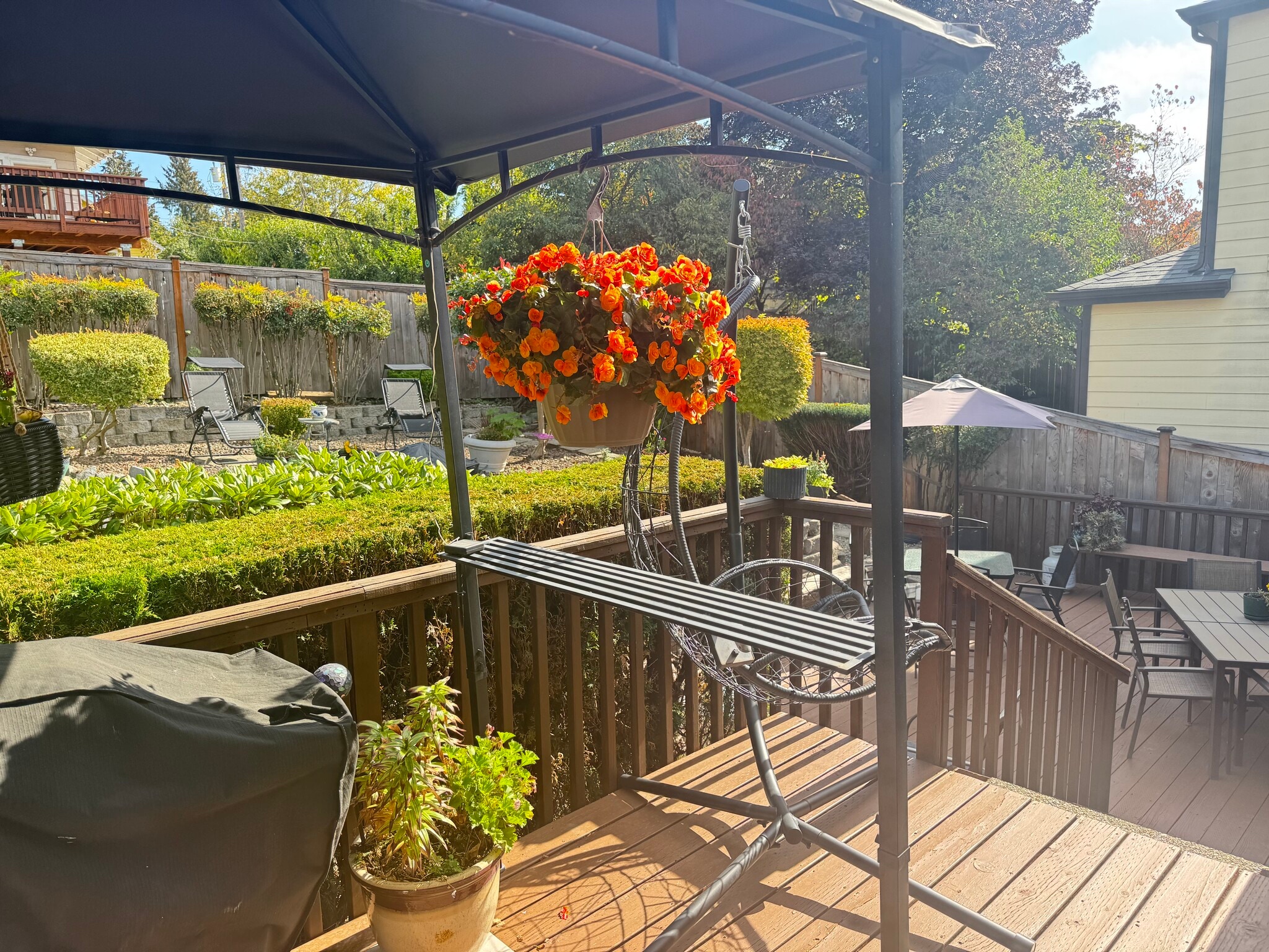 Back deck with covered BBQ for year-round grilling and entertainment - 932 22nd Ave S