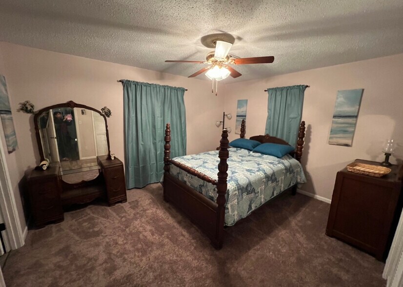 Master room with darkening curtains , black shades and 2 inch wood blinds - 451 Marion Ave