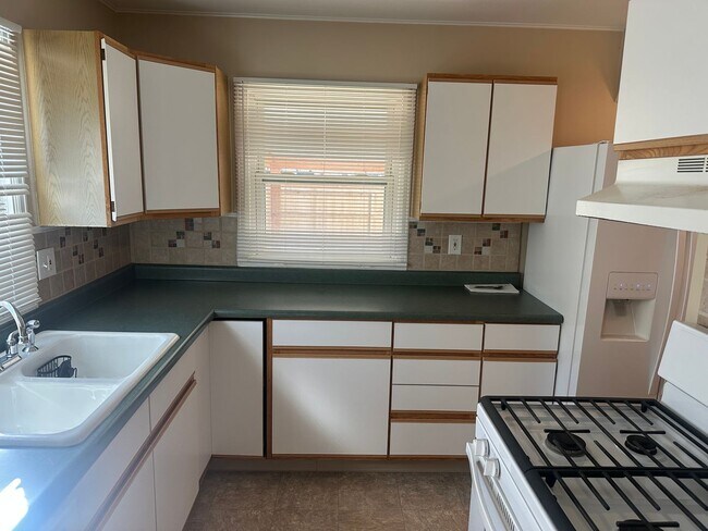 Building Photo - Sunnyside Charmer with Garage & Private Yard