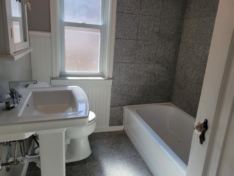 Granite tile floor and bath inlay - 7230 W Park Ave