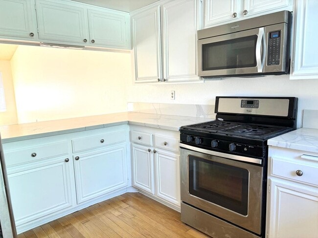 Building Photo - Available Now is a Condo style Townhouse i...