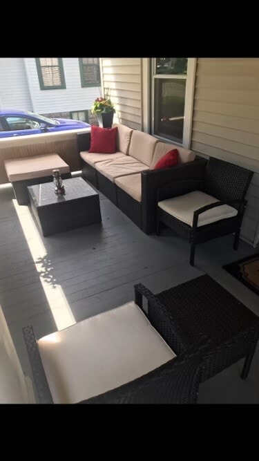 Spacious covered front porch overlooks quiet tree-lined street. - 61 Hirschfield Dr