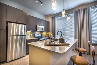 Building Photo - Modern Design Meets Everyday Luxury
