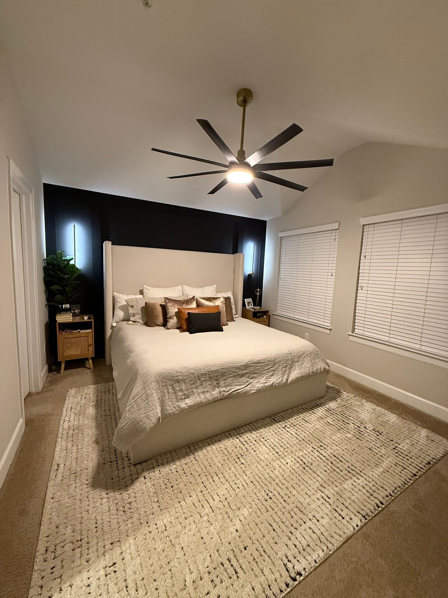 3rd level- Master bedroom with black accent wall and updated fixtures - 8705 Bryam