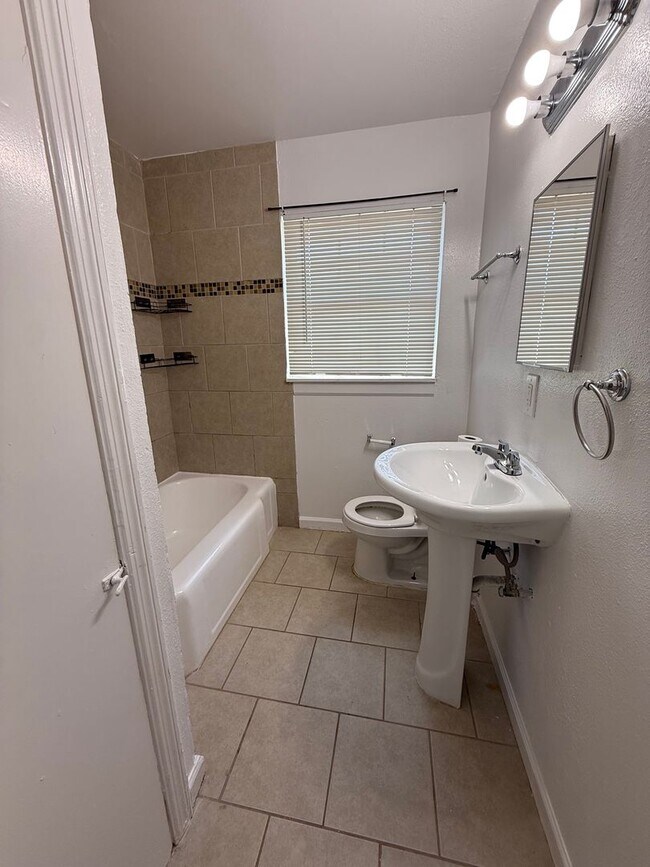 Building Photo - Charming 3BR Home w/ Hardwood Floors & Private Yard – Great SA Location