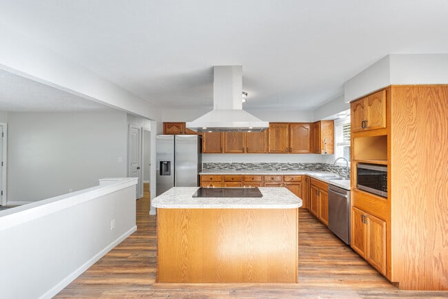 Building Photo - BEAUTIFUL UPDATED RAMBLER WITH LARGE GARGE