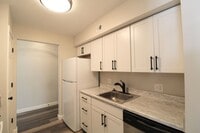Building Photo - Fun and Stylish Living at Madison Manor! Top-Floor Condo with Vaulted Ceilings and Skylights