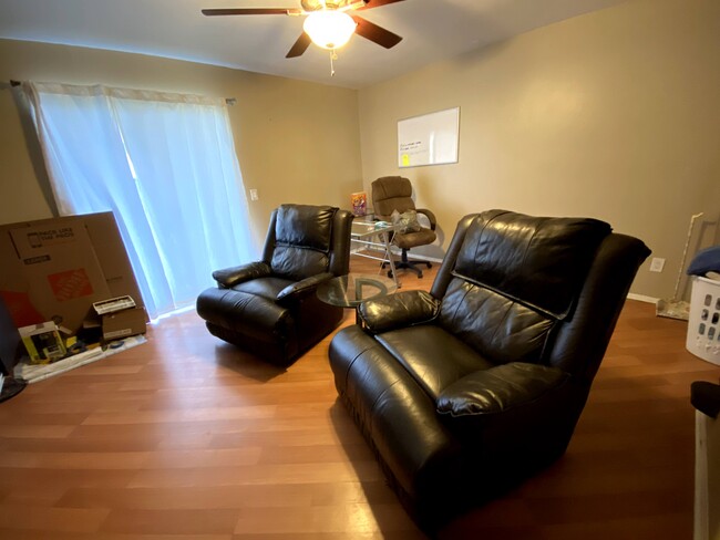 Living room area with private balcony access. Washer and dryer unit is located in a balcony closet. - 14448 Reuter Strasse Cir