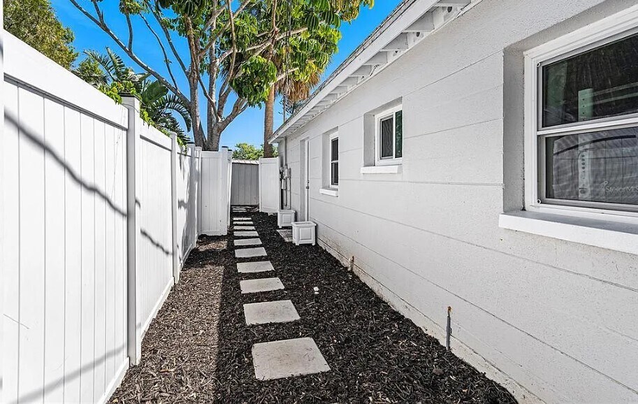 Walkway between both large yard. - 7401 35th Ave N
