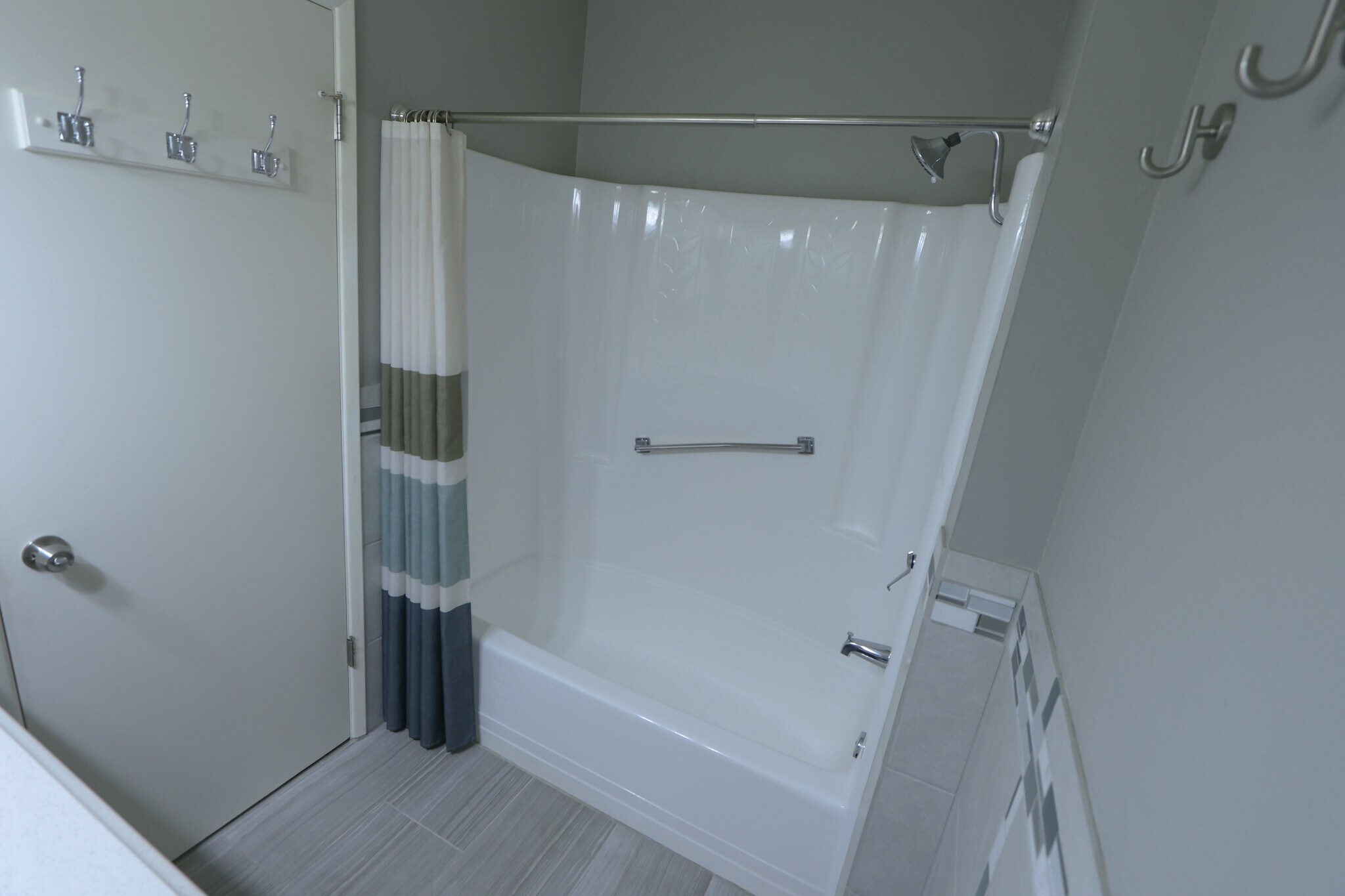 Safety rails in bathrooms - 10941 W Santa Fe Dr
