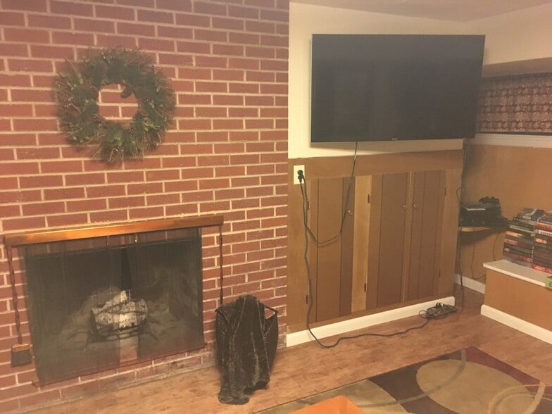 Lower level wood burning fireplace - 1815 E Park Ave