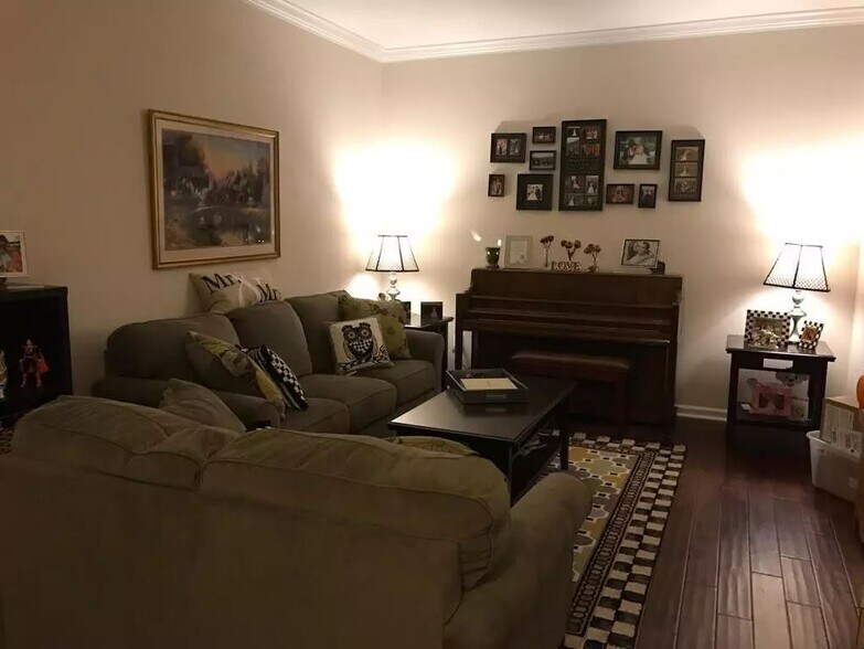 Welcome home with a spacious front formal room, complete with hardwood flooring that fills the main level. Bay window. - 1809 Stark Drive