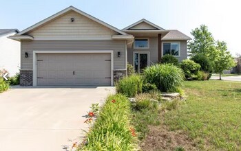Building Photo - Updated 4 Bedroom Home with Remodeled Kitchen & Tiered Deck