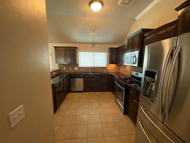 Building Photo - 4 bed, 2 bath, 2 car garage, 12-14 person Storm Shelter