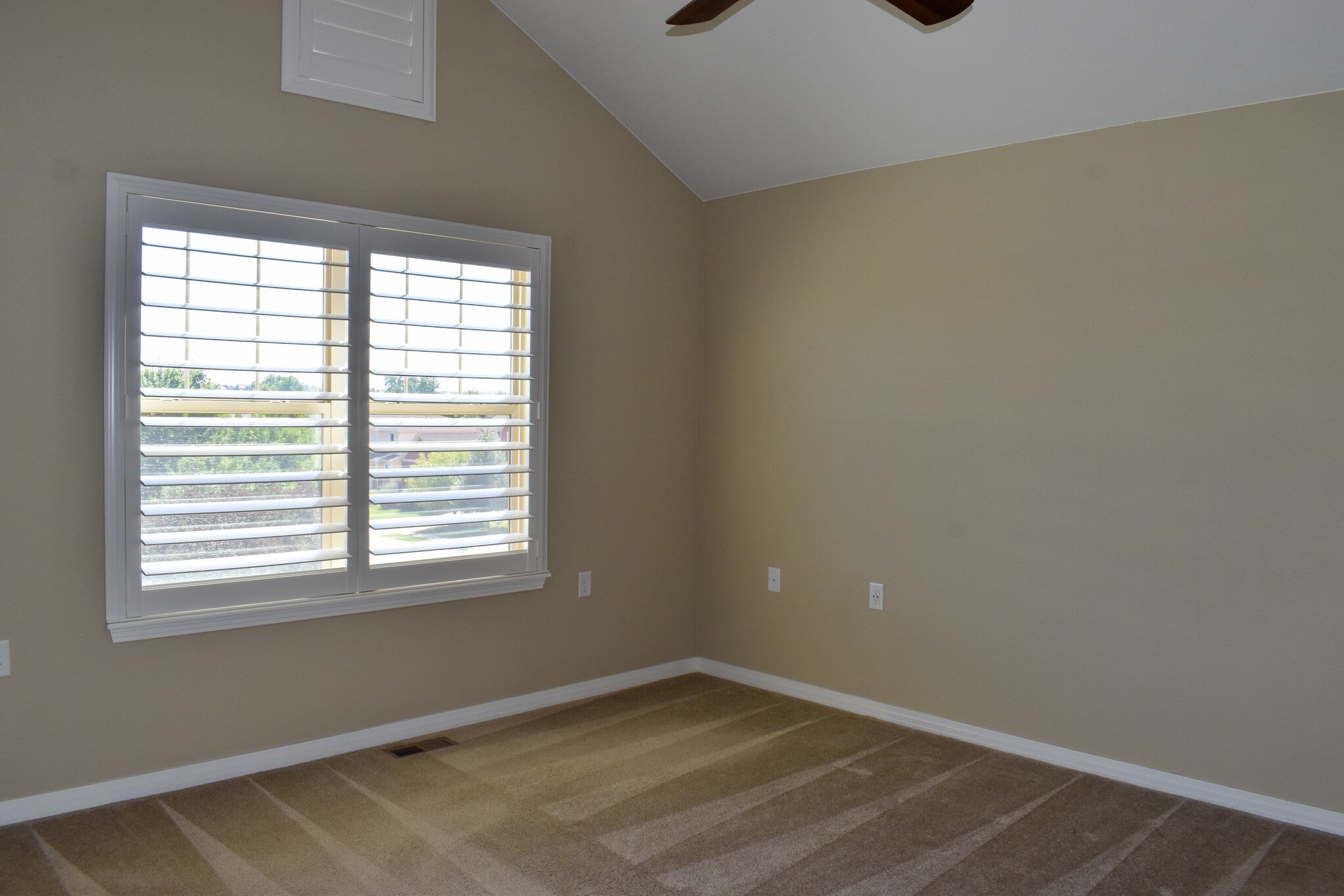 Primary Bedroom with Vaulted Ceilings, Ceiling Fan and Plantation Shutters - 684 Mason St