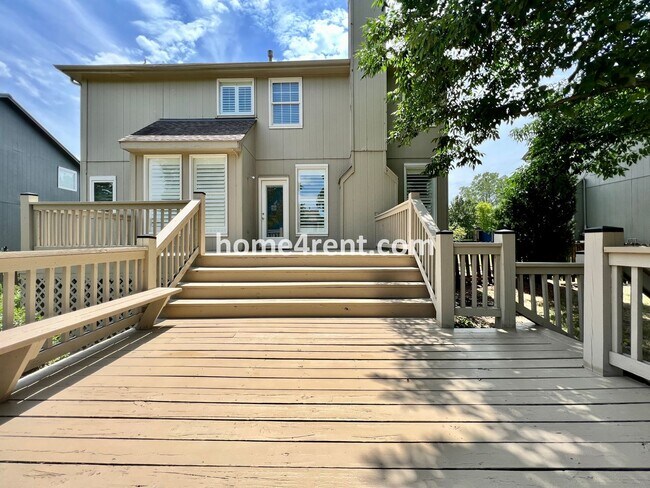 Building Photo - Updated Kitchen, Large Two Tiered Deck, Finished Basement in Blue Valley Schools!
