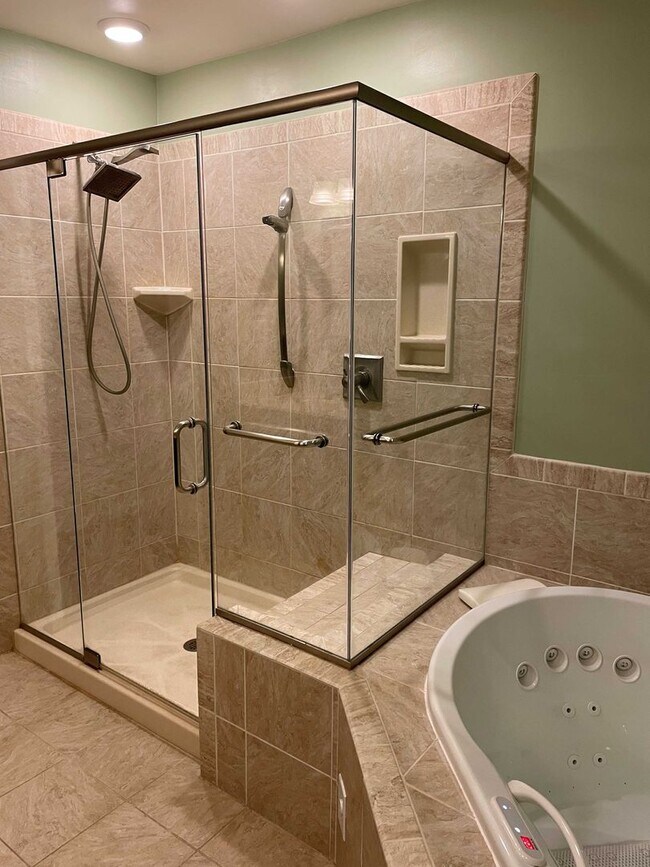 Building Photo - Spacious 3BR Townhome with Walkout Basement, Deck, Fenced Yard, Central A/C + Assigned Parking