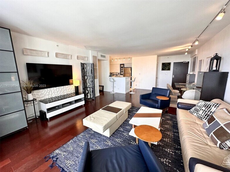 living/dining and kitchen area with extra storage. - 1500 Bay Rd