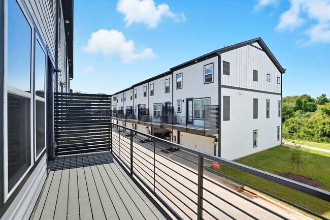 Building Photo - Brand-new three-story townhome in the Univ...