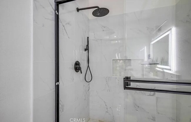 Building Photo - "Chic 1-Bedroom Retreat with Movie Room & ...