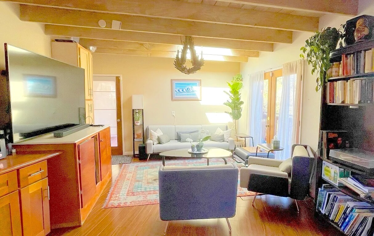 Second living room / den area on first floor with doors out to deck overlooking Soquel creek. - 3560 Paper Mill Rd