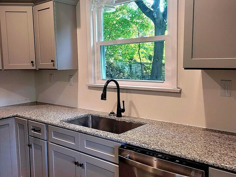 double sink with new cabinets and granite countertops - 14 Liberty St