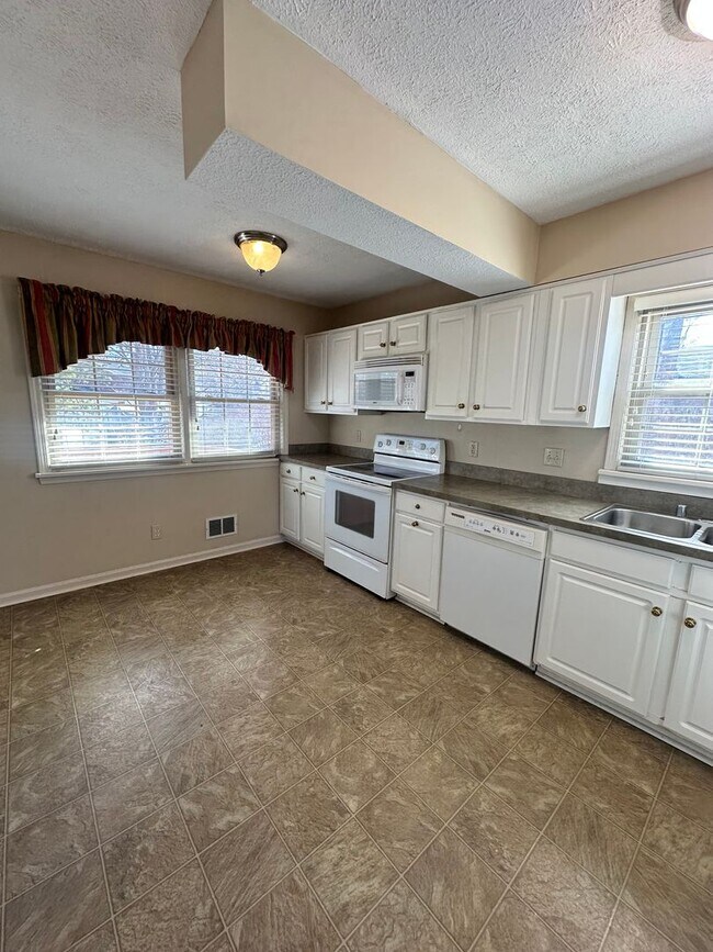 Building Photo - 3BR/3BA Home for Rent in J-town with Two Gar Garage and Large Deck!