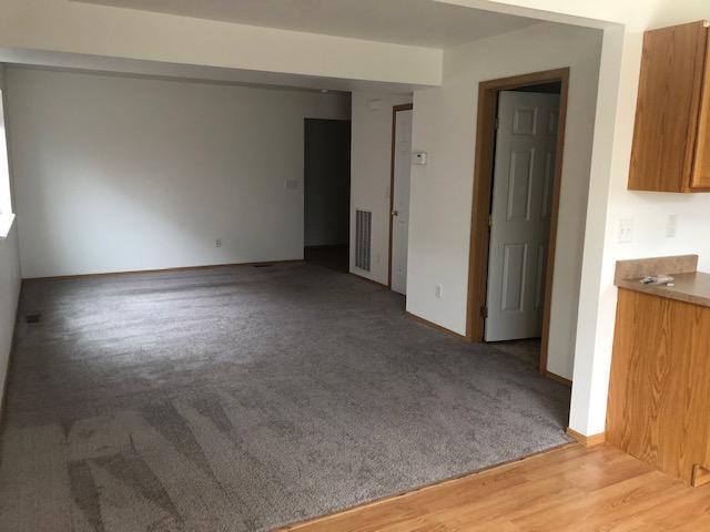LIVING ROOM - NEW CARPET AND PAINT (GUEST BATH WITH WASHER AND DRYER AT SIDE) - 469 W Shore Dr