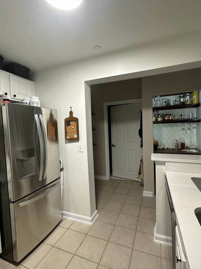 dry bar and bathroom door from kitchen - 23 Pierside Dr