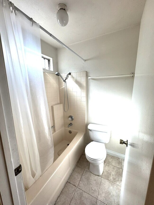 Building Photo - 2 Bedroom, 2 Bath Upstairs Condo with Private Balcony & 2-Car Garage, Gated Community, Water/Tras...