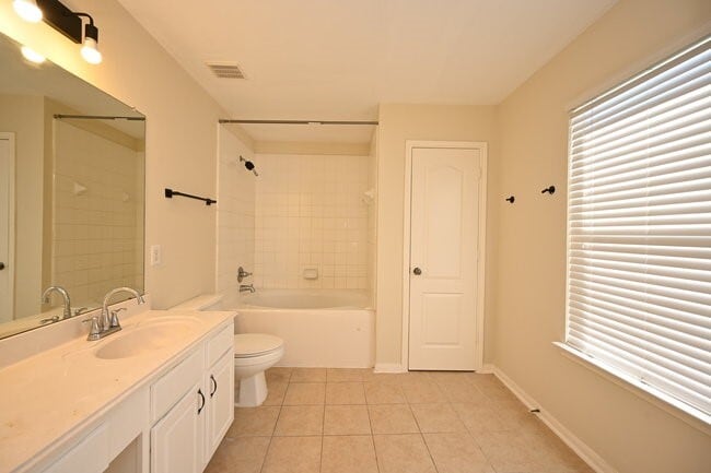 Building Photo - 9403 Coatsworth Dr