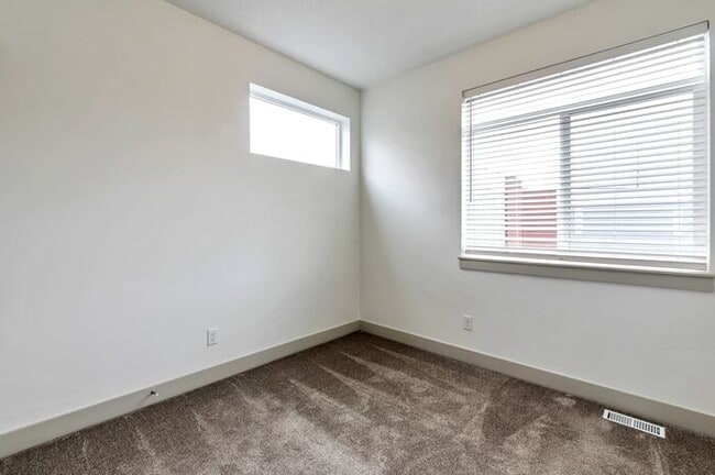 Building Photo - Modern End Unit townhouse w attached 2 car...