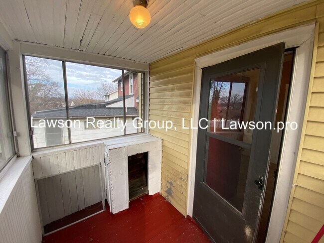 Building Photo - Updated Three Bedroom with Flat Yard