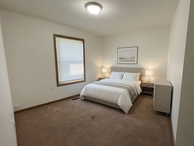 Building Photo - For Rent - 4 Bedroom, 2 Full Bath Home with Ground-Floor Bedroom, Attached Garage and Brand-New K...