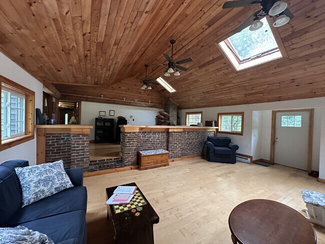 Building Photo - Charming 3BR Waterfront Retreat with Sunroom, Brick Accent & Scenic Lake Views