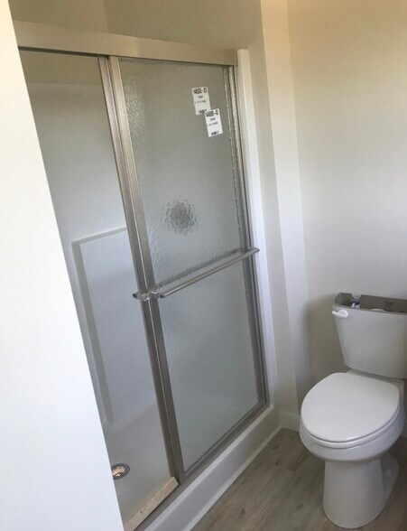 Brushed nickel shower door. - 129 Cunningham Ln