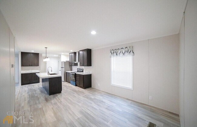 Building Photo - Spacious 4-Bedroom Home with Lawn Maintena...