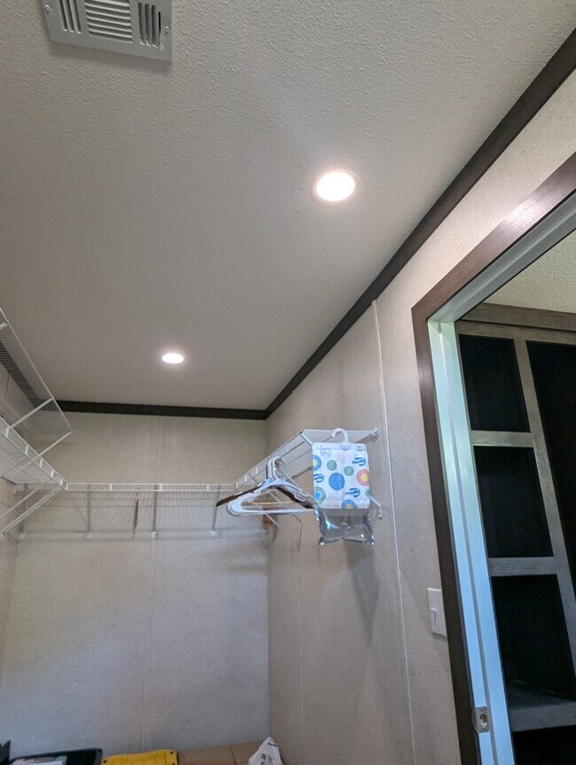 Large Master Closet looking into bathroom built in shelves - 179 Davis Rd