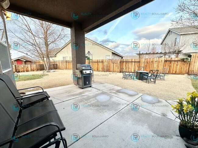 Building Photo - Open Kitchen, Expansive Living, and Covered Patio in Tranquil South Reno Near Trails, Parks & Sho...