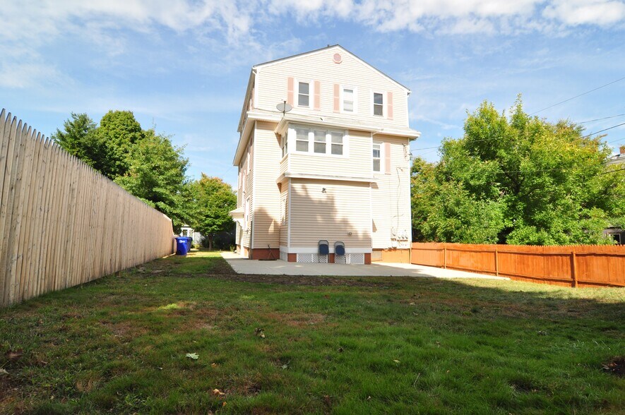 Fenced in backyard with concrete pads - 82 Roanoke St